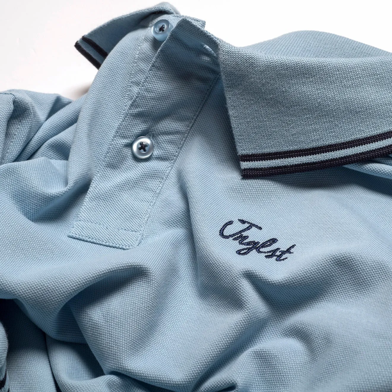 Sky Blue Jnglst Polo Shirt with Navy Detailing